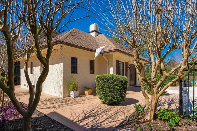 a view of a house with a tree