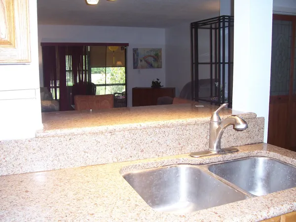 a view of a kitchen counter top space with a sink