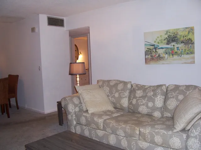 a bedroom with a bed and a chair