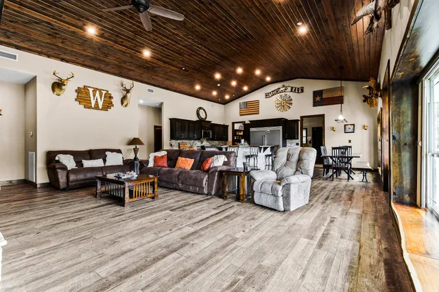 a living room with furniture and flat screen tv