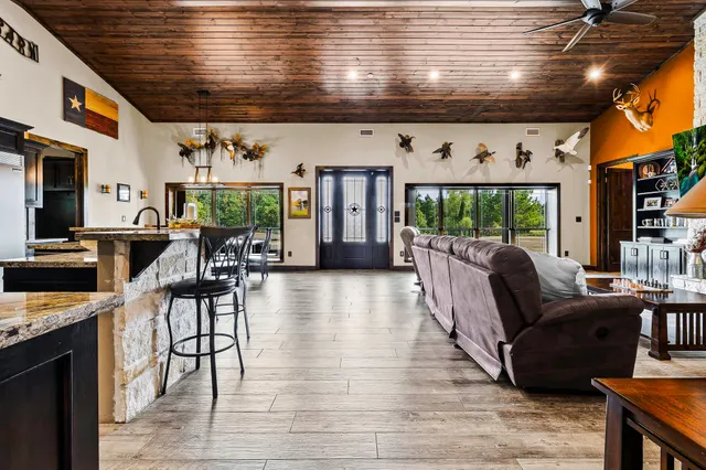 a bedroom with furniture and a fireplace