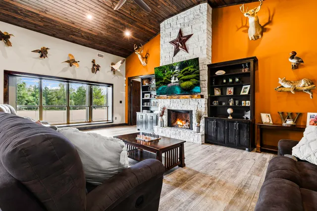 a view of a kitchen with furniture and wooden floor
