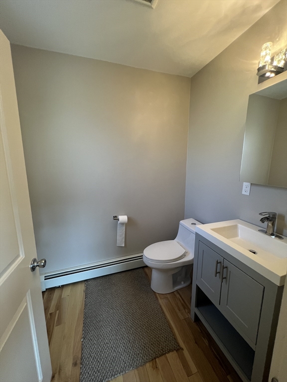 39 Snow Street, Unit 1 Boston, MA 02135 - Photo 14 of 35 a bathroom with a toilet sink and vanity