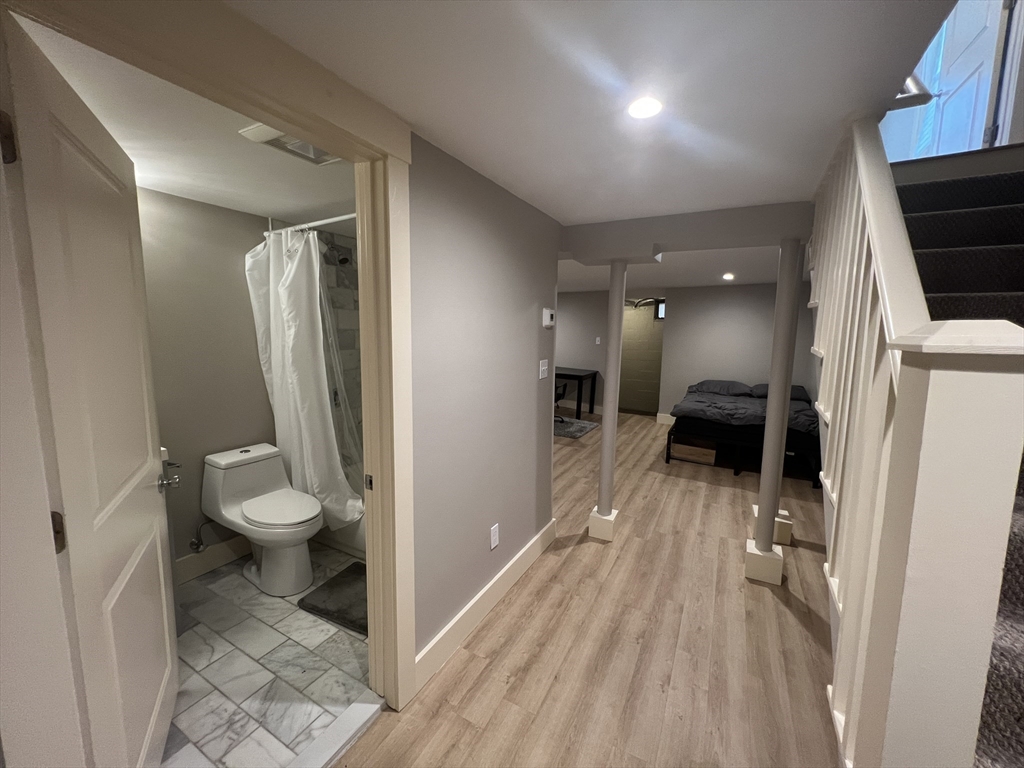 39 Snow Street, Unit 1 Boston, MA 02135 - Photo 16 of 35 a bathroom with a sink toilet and shower