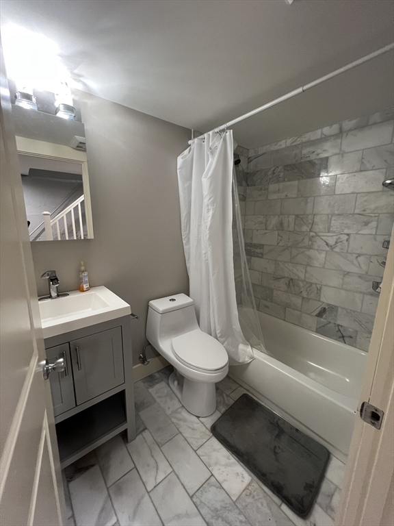 39 Snow Street, Unit 1 Boston, MA 02135 - Photo 17 of 35 a bathroom with a sink toilet and shower