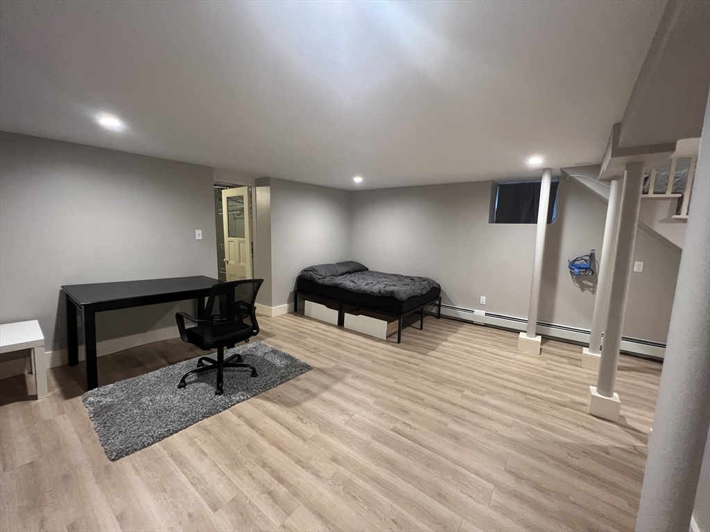 39 Snow Street, Unit 1 Boston, MA 02135 - Photo 22 of 35 a view of a livingroom with workspace and a couch