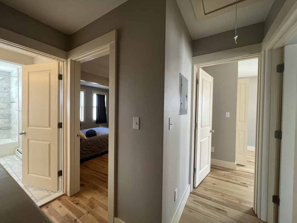39 Snow Street, Unit 1 Boston, MA 02135 - Photo 25 of 35 a view of a hallway with a room