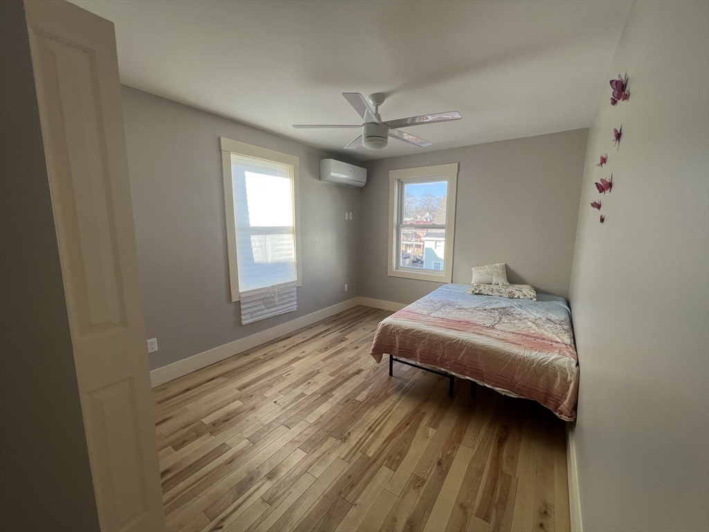 39 Snow Street, Unit 1 Boston, MA 02135 - Photo 26 of 35 a bedroom with a bed and window