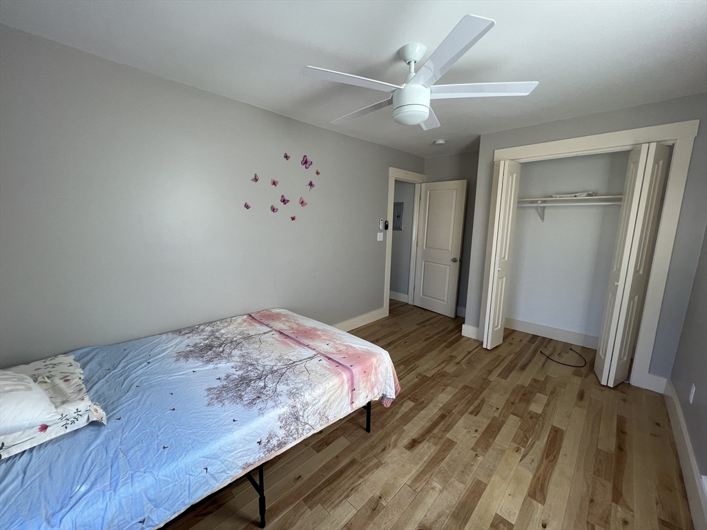 39 Snow Street, Unit 1 Boston, MA 02135 - Photo 28 of 35 a bedroom with a bed and a window