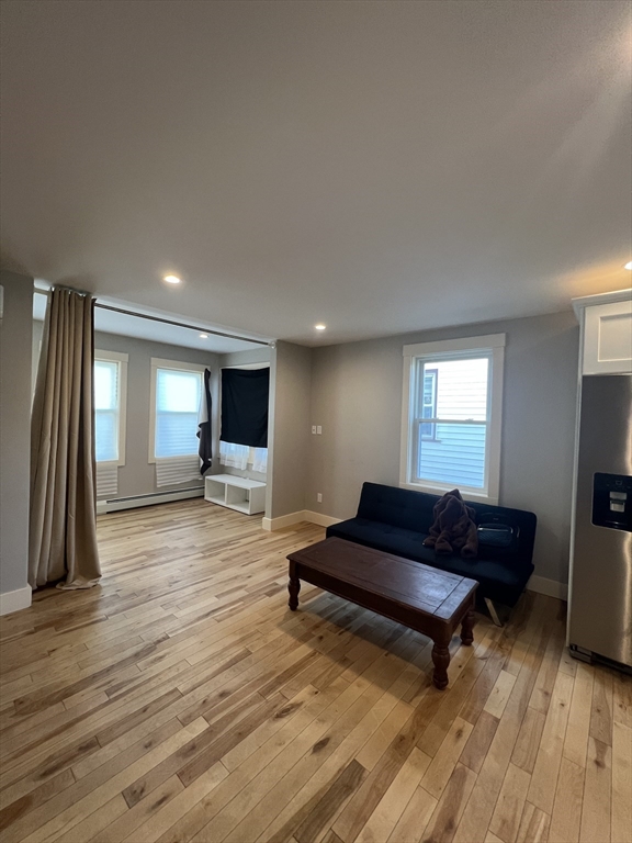 39 Snow Street, Unit 1 Boston, MA 02135 - Photo 5 of 35 a living room with furniture and a flat screen tv