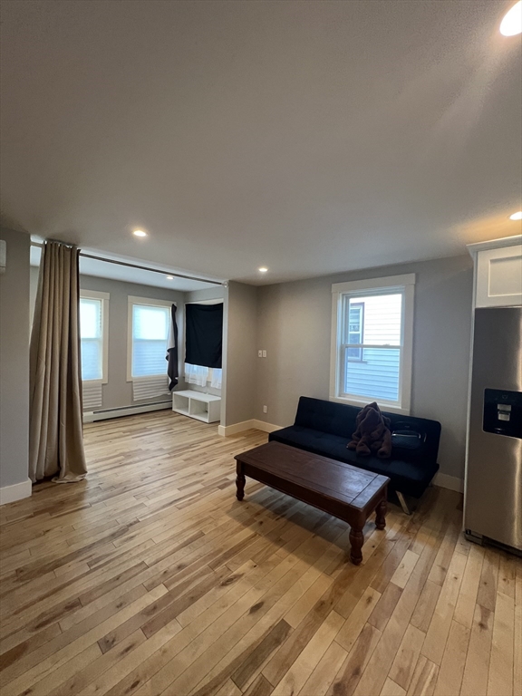 39 Snow Street, Unit 1 Boston, MA 02135 - Photo 6 of 35 a living room with furniture and a flat screen tv