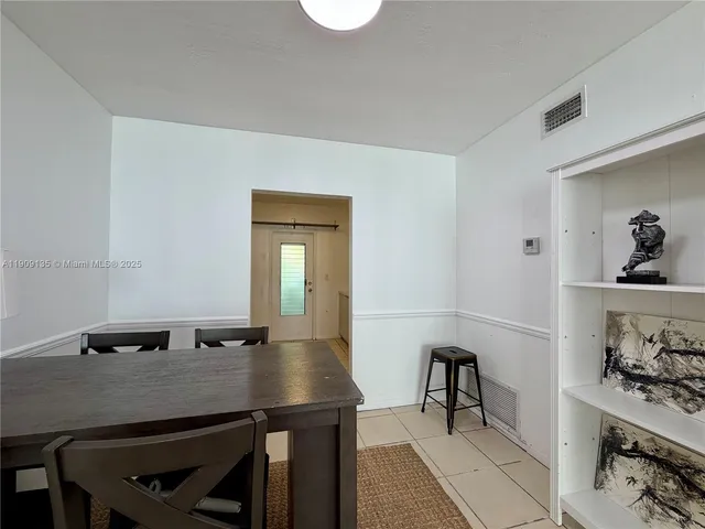 a view of a workspace with furniture