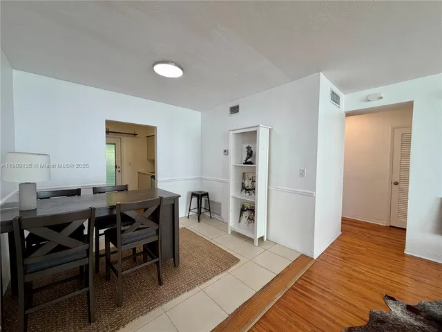 a view of a livingroom with furniture and wooden floor