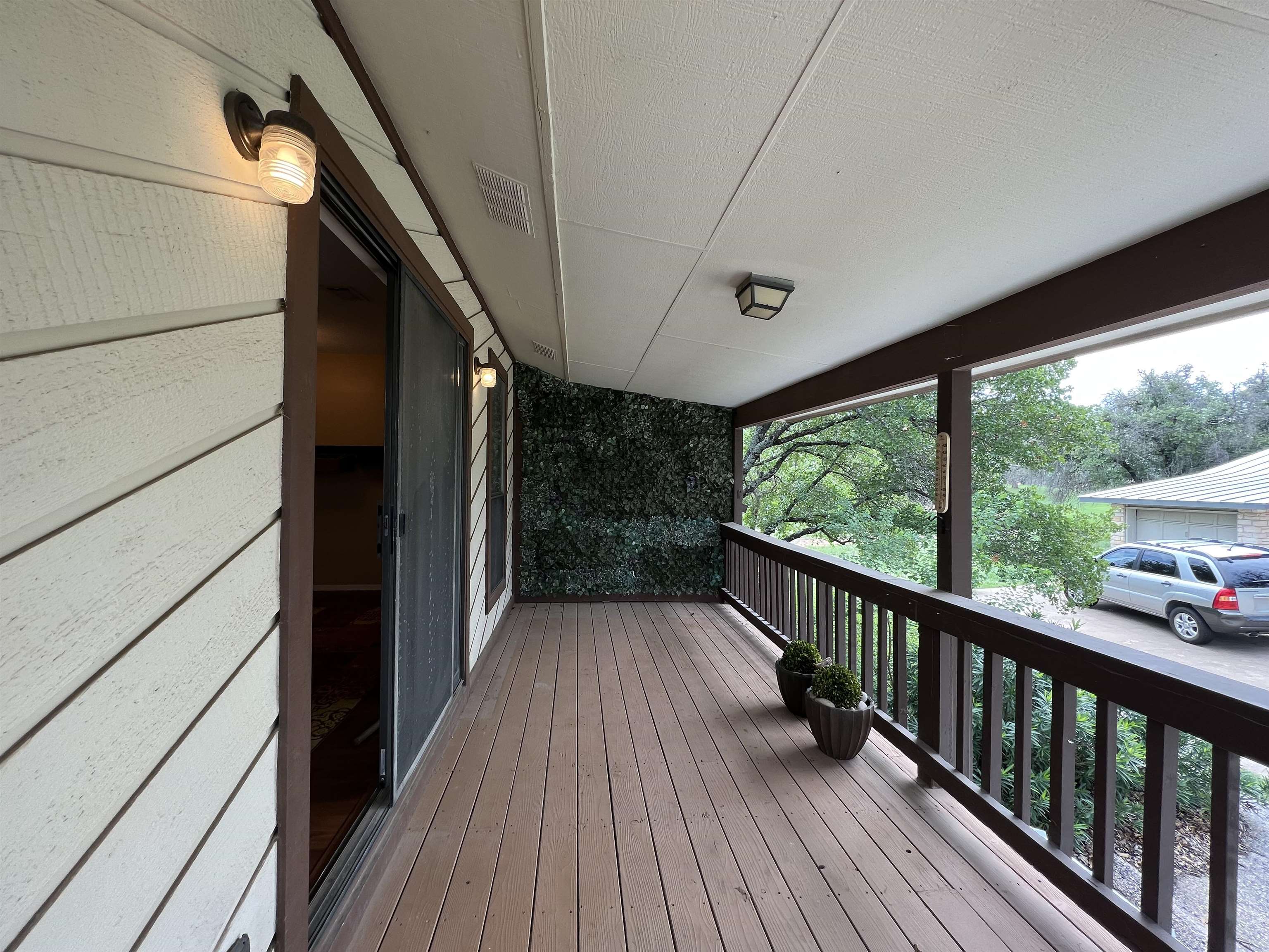 116 Dawn, Unit B Horseshoe Bay, TX 78657 - Photo 17 of 24 a view of balcony with wooden floor