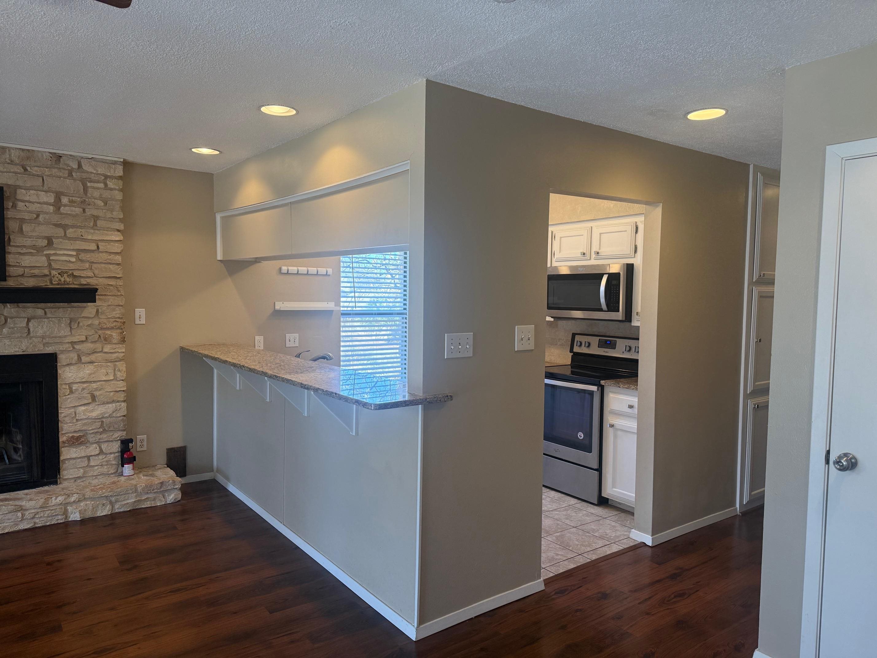 116 Dawn, Unit B Horseshoe Bay, TX 78657 - Photo 10 of 24 a view of kitchen and wooden floor