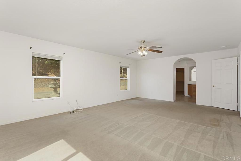 1691 Hubbard Place Escondido, CA 92027 - Photo 19 of 39 an empty room with a natural light