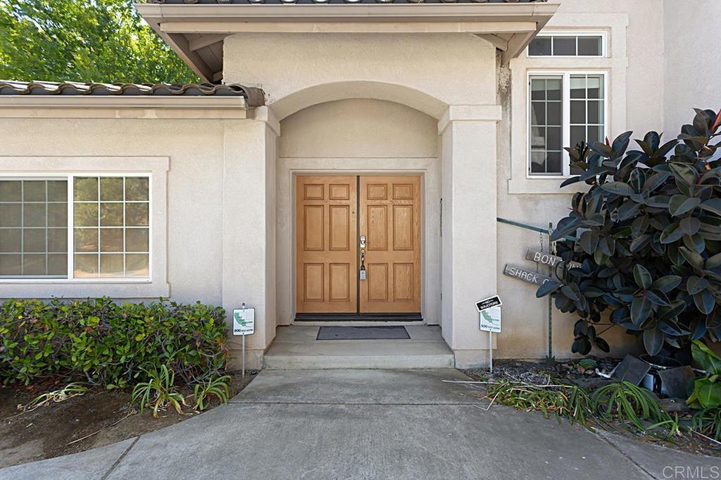 1691 Hubbard Place Escondido, CA 92027 - Photo 2 of 39 a front view of a house with a garden
