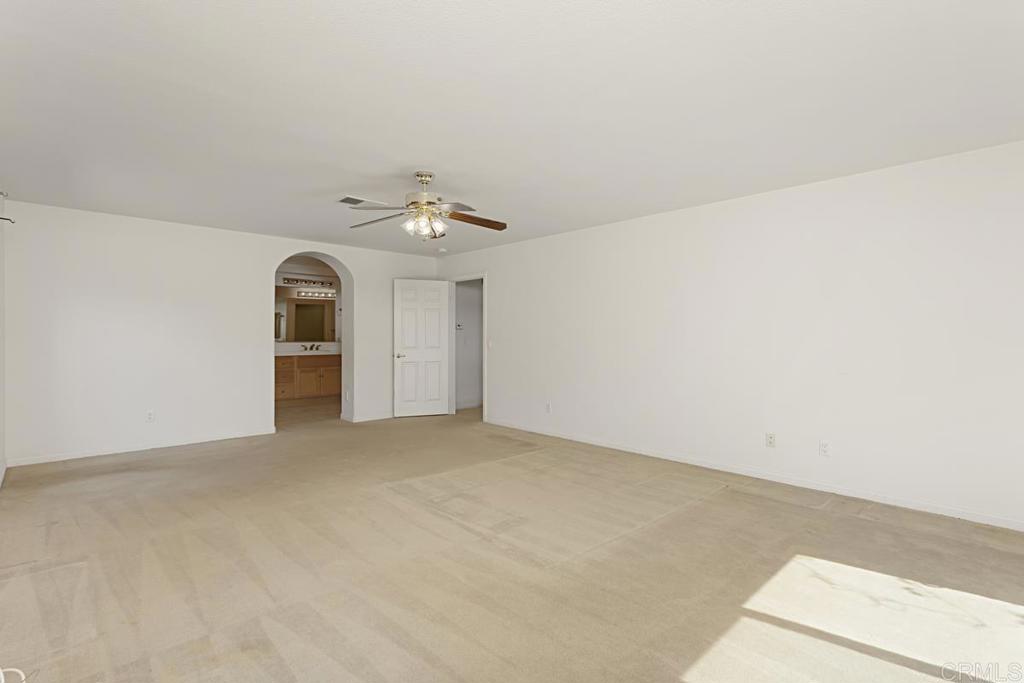 1691 Hubbard Place Escondido, CA 92027 - Photo 21 of 39 an empty room with a natural light