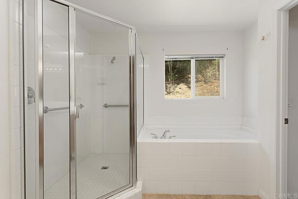 1691 Hubbard Place Escondido, CA 92027 - Photo 25 of 39 a bathroom with a bathtub and shower