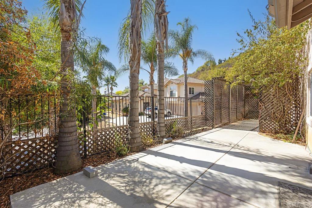 1691 Hubbard Place Escondido, CA 92027 - Photo 35 of 39 a view of a backyard with a trees