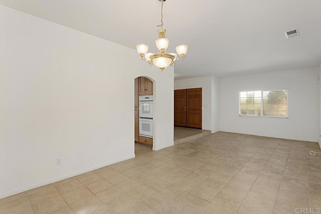 1691 Hubbard Place Escondido, CA 92027 - Photo 7 of 39 a view of an empty room with a window