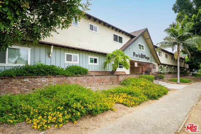 a front view of a house with a yard and porch