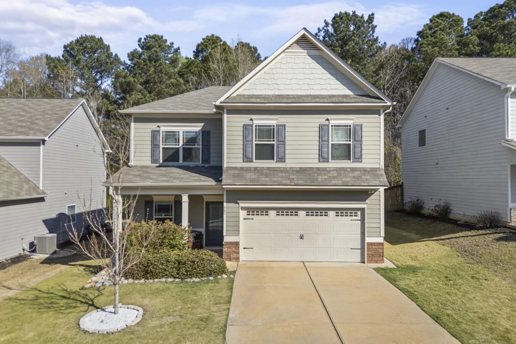 a front view of a house with a yard