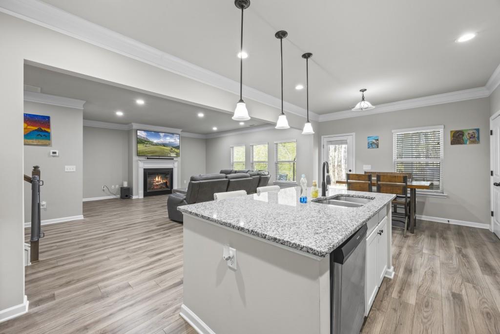 660 Country Ridge Drive Hoschton, GA 30548 - Photo 17 of 58 a kitchen with a stove and a wooden floor