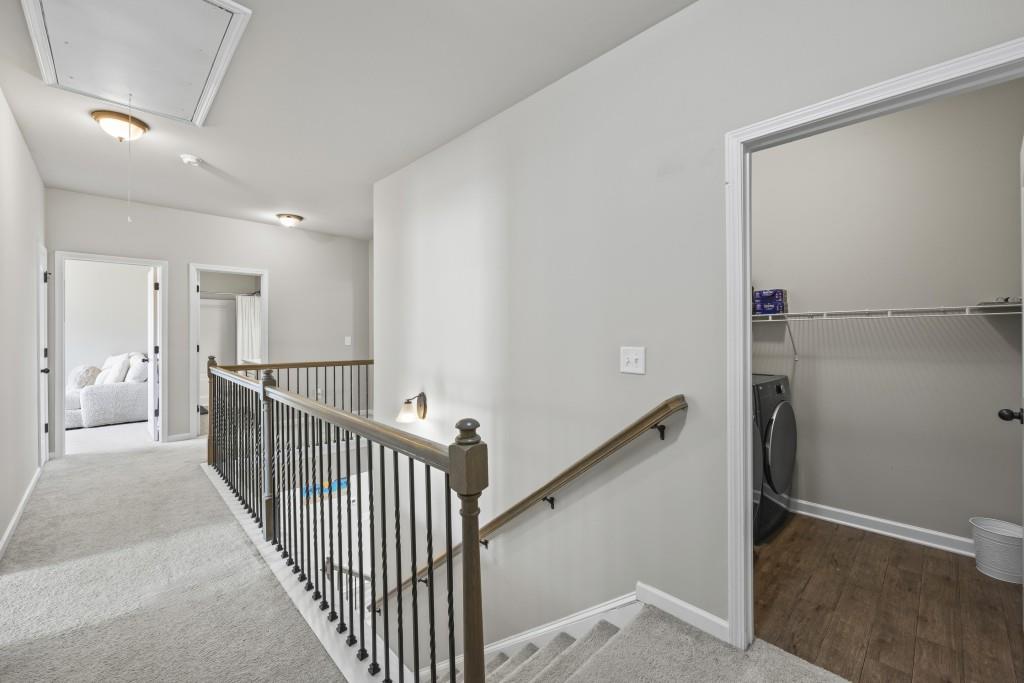 660 Country Ridge Drive Hoschton, GA 30548 - Photo 24 of 58 a view of a hallway with closet