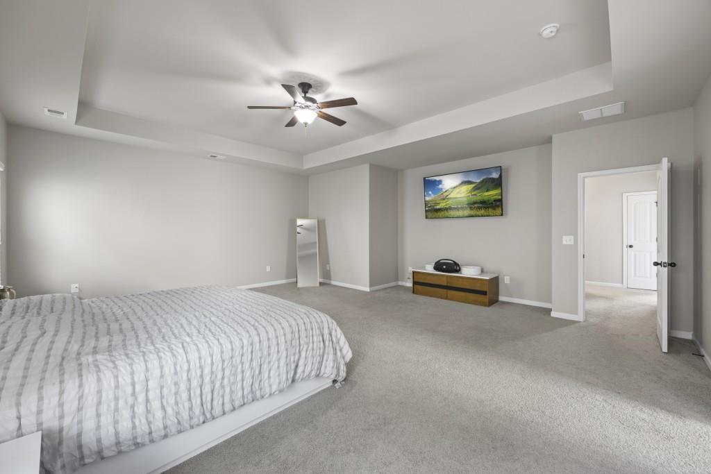 660 Country Ridge Drive Hoschton, GA 30548 - Photo 33 of 58 a bed room with a bed