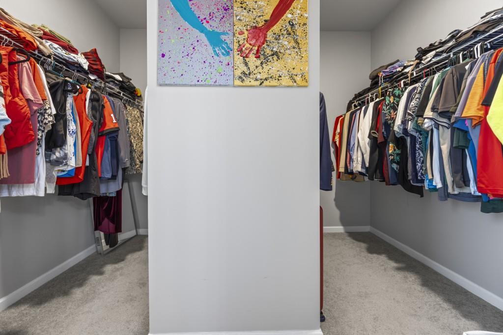 660 Country Ridge Drive Hoschton, GA 30548 - Photo 41 of 58 a view of walk in closet with clothes and shoes