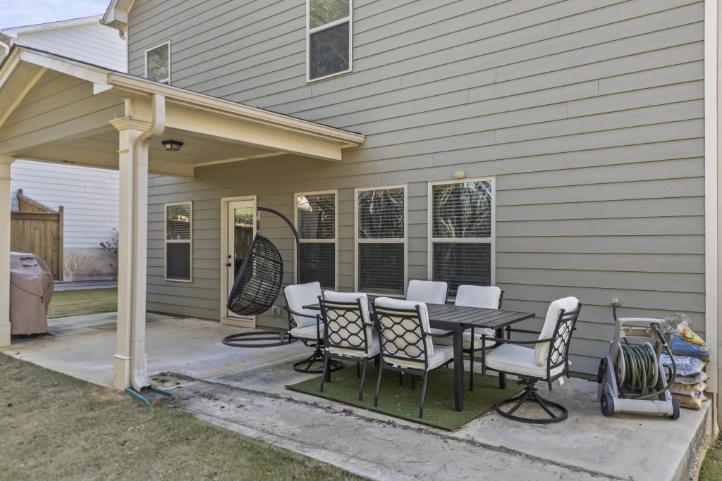 660 Country Ridge Drive Hoschton, GA 30548 - Photo 46 of 58 a patio with table and chairs