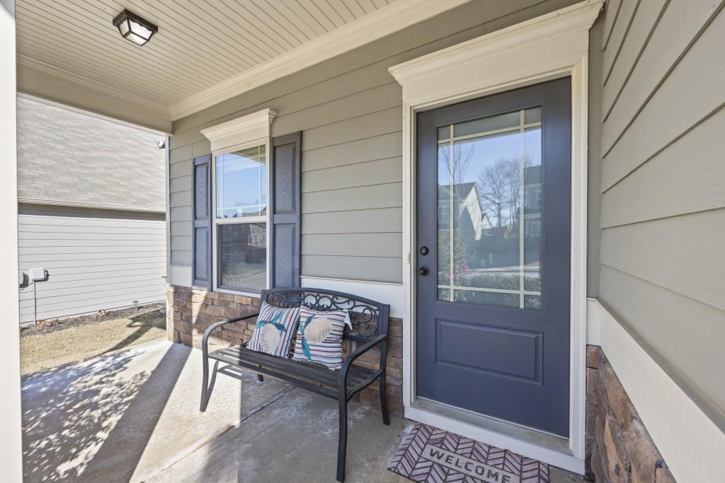 660 Country Ridge Drive Hoschton, GA 30548 - Photo 5 of 58 a balcony with furniture and next to a window