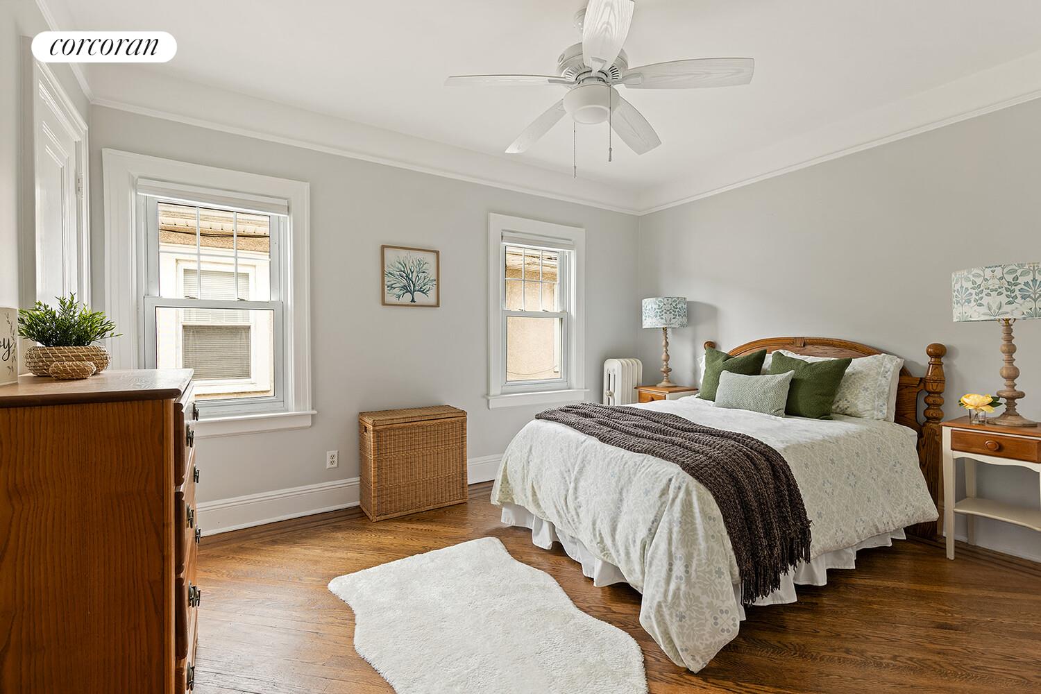 7709 Colonial Road Brooklyn, NY 11209 - Photo 8 of 13 a bedroom with a bed and wooden floor
