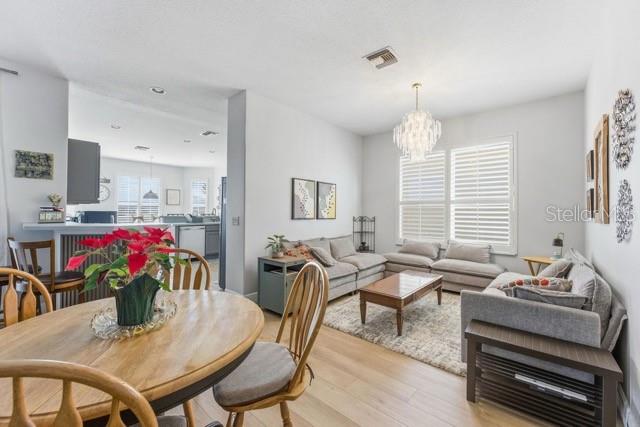 1338 Southwest 161st Place Ocala, FL 34473 - Photo 11 of 76 a view of a dining room with furniture window and wooden floor