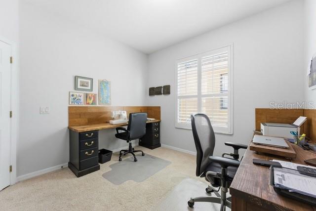 1338 Southwest 161st Place Ocala, FL 34473 - Photo 13 of 76 a view of a workspace with furniture and a window