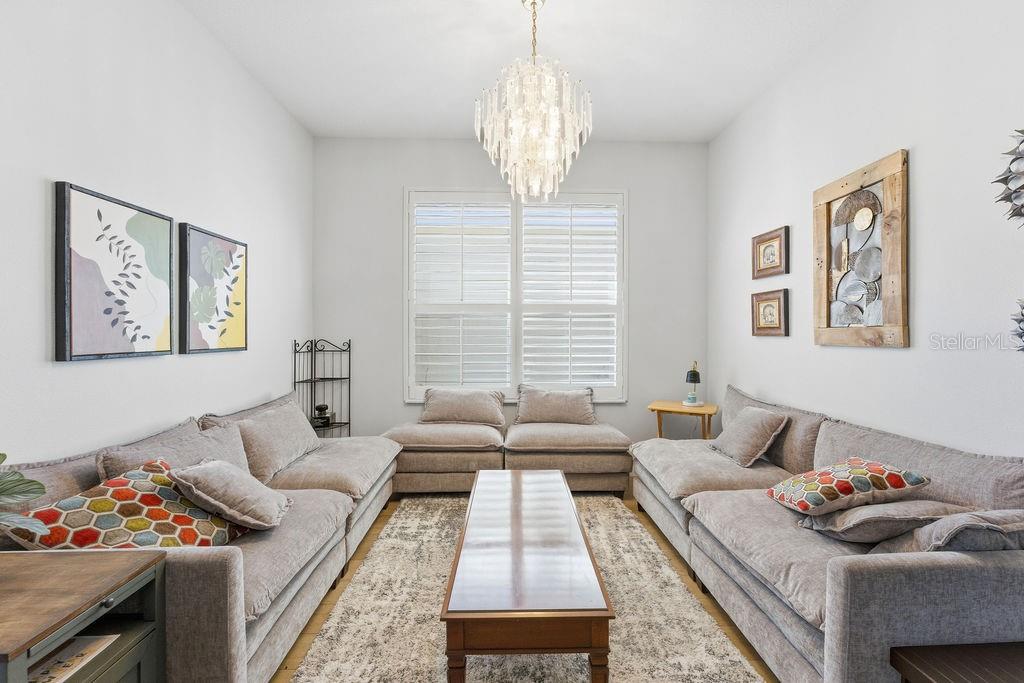 1338 Southwest 161st Place Ocala, FL 34473 - Photo 15 of 76 a living room with furniture and a large window