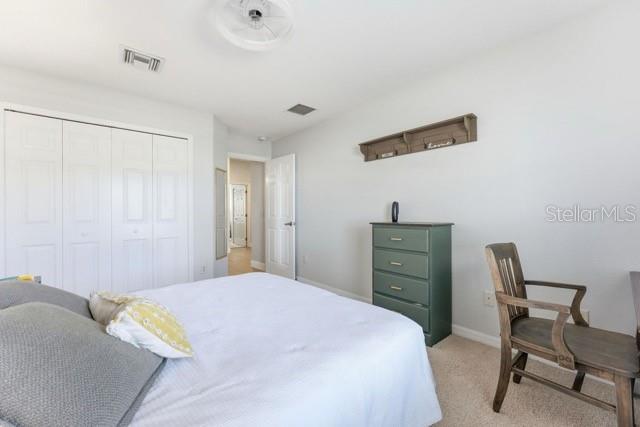 1338 Southwest 161st Place Ocala, FL 34473 - Photo 28 of 76 a bedroom with a bed and a chair in it