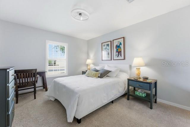 1338 Southwest 161st Place Ocala, FL 34473 - Photo 29 of 76 a bedroom with a bed and a desk