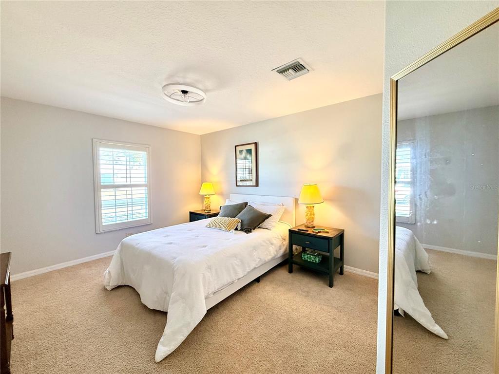 1338 Southwest 161st Place Ocala, FL 34473 - Photo 35 of 76 a bedroom with a bed and window