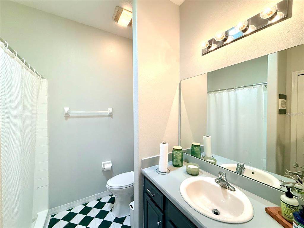 1338 Southwest 161st Place Ocala, FL 34473 - Photo 37 of 76 a bathroom with a granite countertop sink toilet and a mirror
