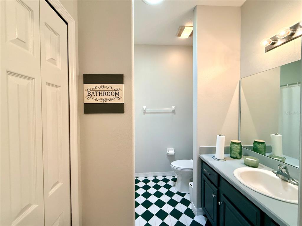 1338 Southwest 161st Place Ocala, FL 34473 - Photo 38 of 76 a bathroom with a sink a toilet a shower and a mirror