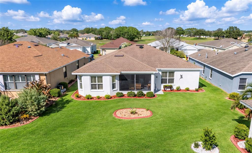 1338 Southwest 161st Place Ocala, FL 34473 - Photo 46 of 76 a front view of a house with a garden and plants