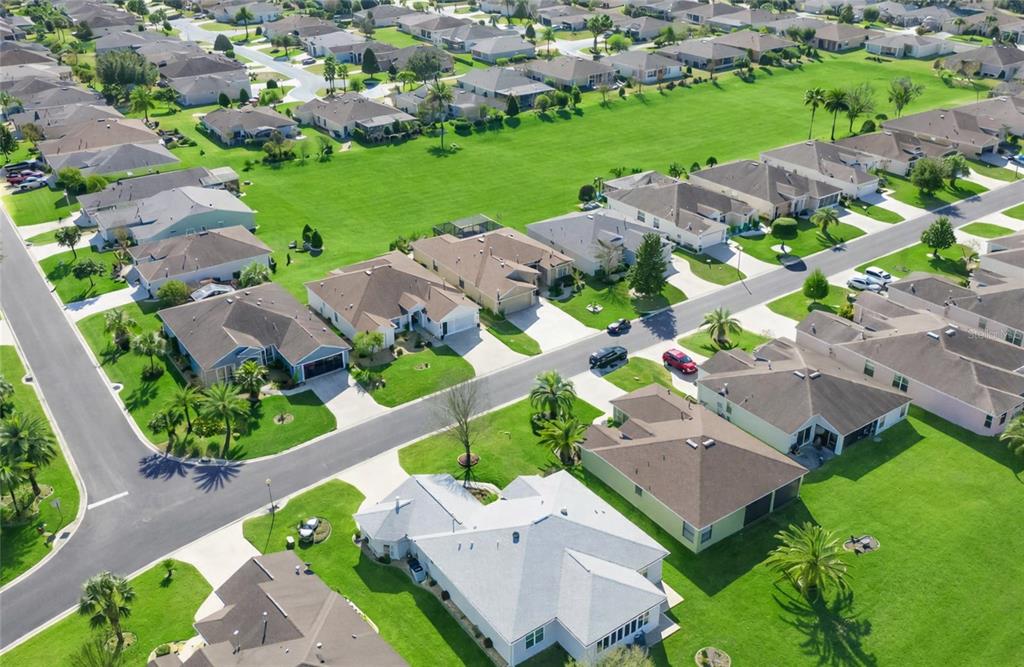 1338 Southwest 161st Place Ocala, FL 34473 - Photo 51 of 76 an aerial view of multiple houses with yard