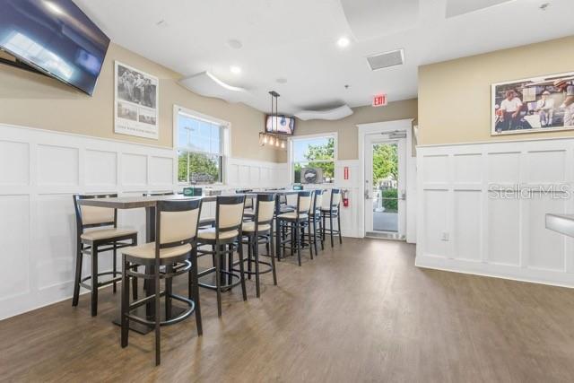 1338 Southwest 161st Place Ocala, FL 34473 - Photo 65 of 76 a view of a dining room with furniture window and wooden floor