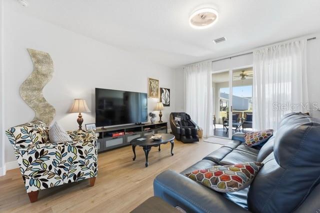 1338 Southwest 161st Place Ocala, FL 34473 - Photo 9 of 76 a living room with furniture and a flat screen tv