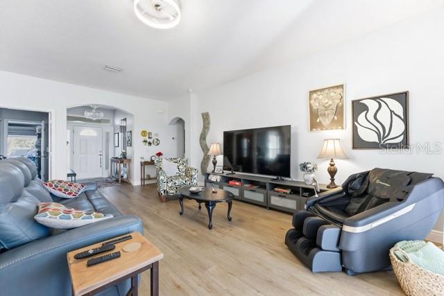 1338 Southwest 161st Place Ocala, FL 34473 - Photo 10 of 76 a living room with furniture and a flat screen tv