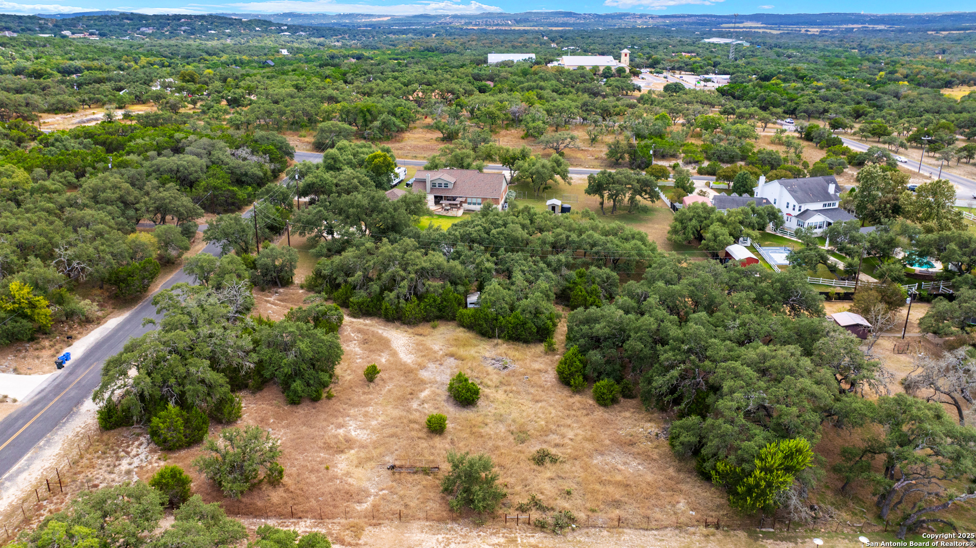 32311 Koch Road Bulverde, TX 78163 - Photo 3 of 14 a view of a city with green field