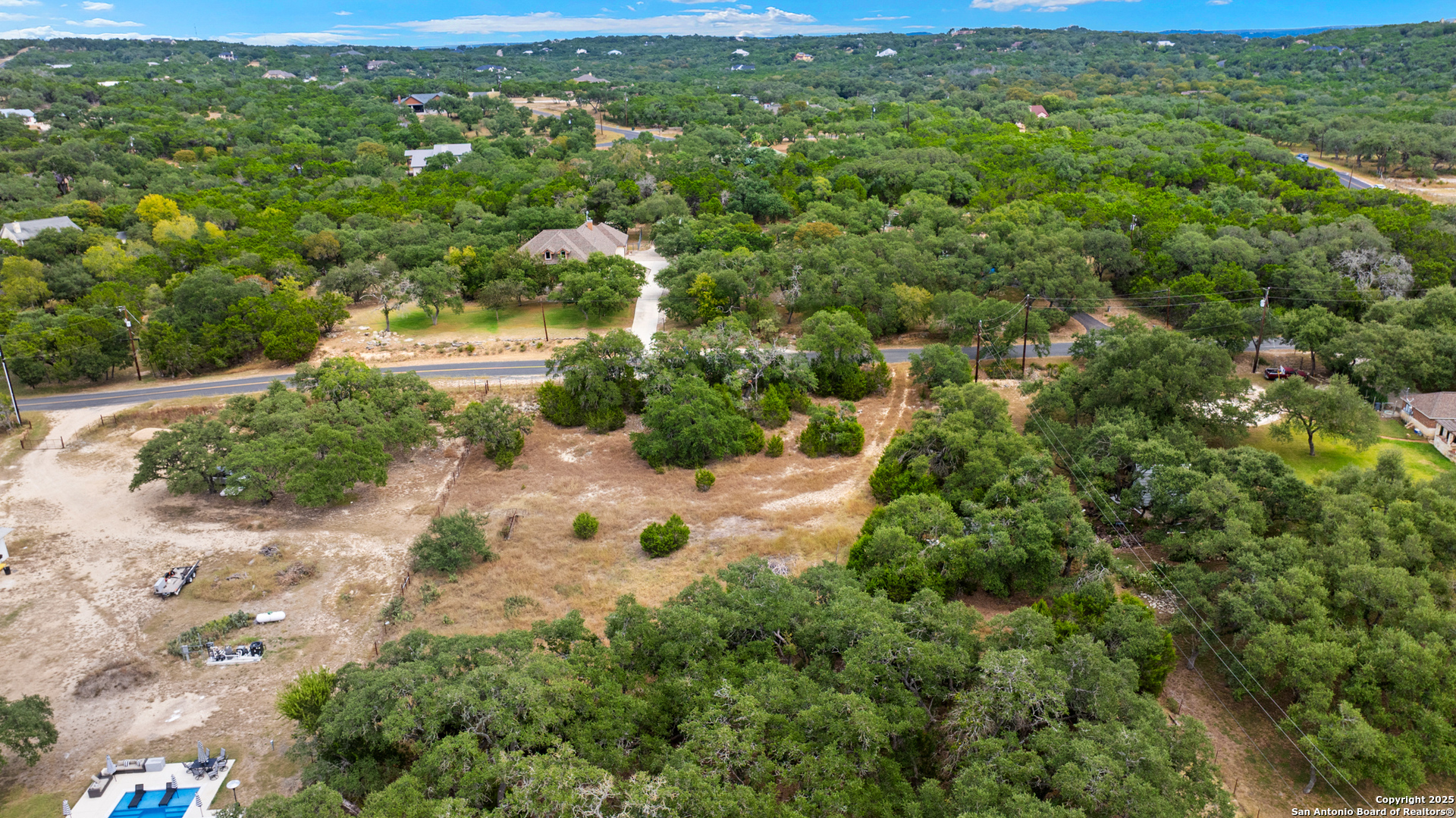 32311 Koch Road Bulverde, TX 78163 - Photo 5 of 14 an aerial view of residential houses with outdoor space and trees