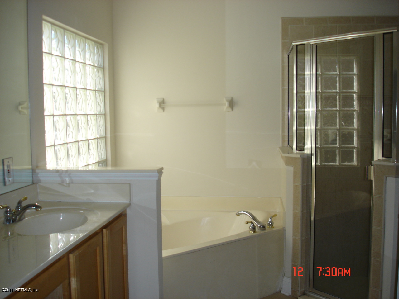 620 Pelham Road St. Augustine, FL 32092 - Photo 7 of 8 a bathroom with a tub sink and shower